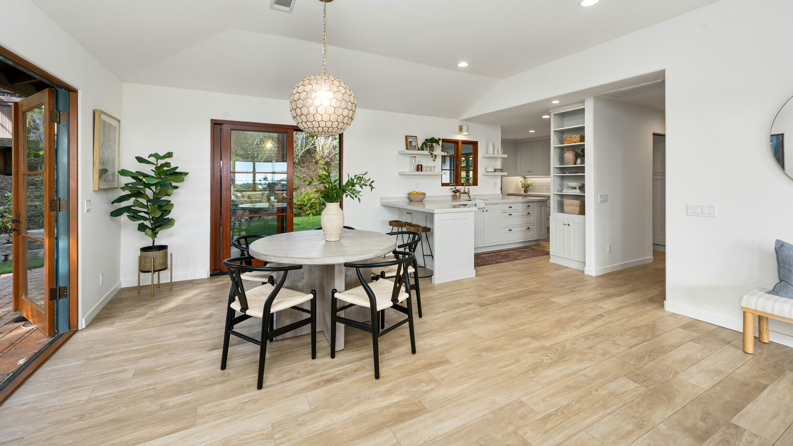 Clean room with a small dining table and kitchen balcony